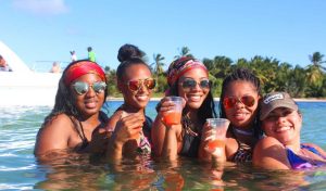 women posing for a picture with drink in hands