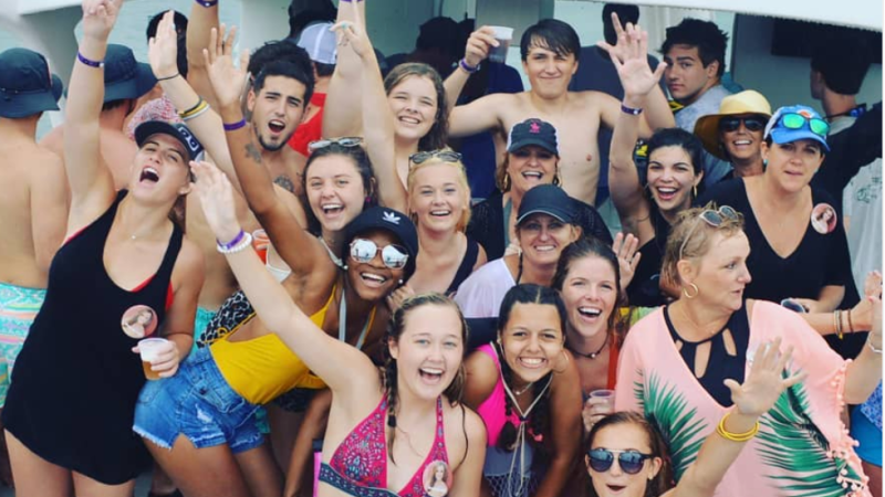 people posing for picture on boat