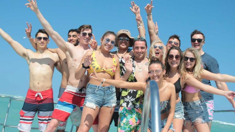 a group posing for a picture on the boat