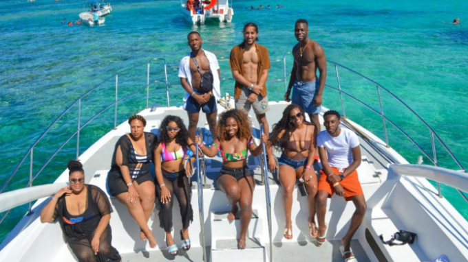 people posing for picture on a boat